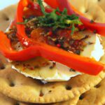 Savory Delight: Goat Cheese Paired with Roasted Red Pepper Crackers